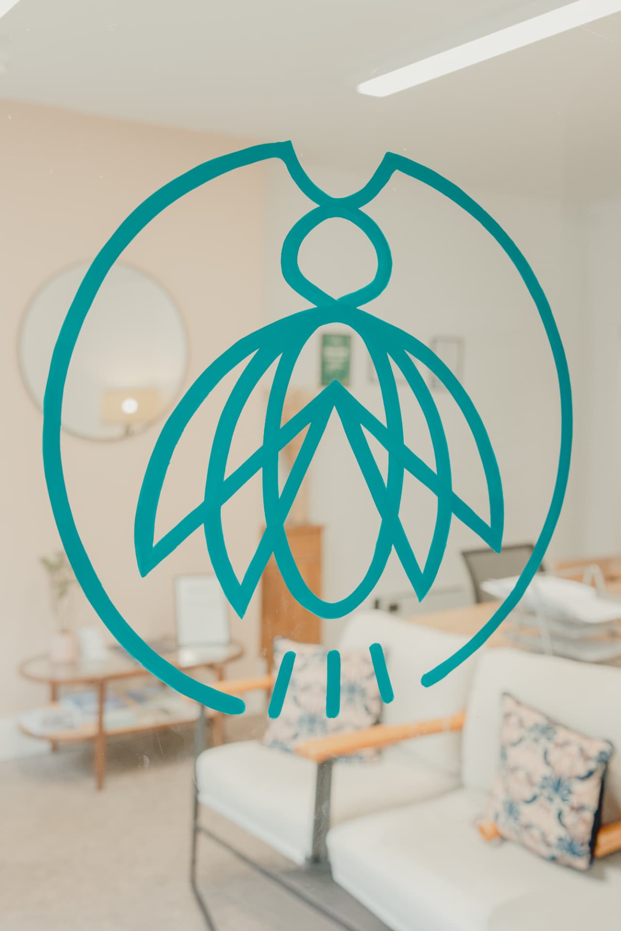 The Firefly mark on the window of the Frome office